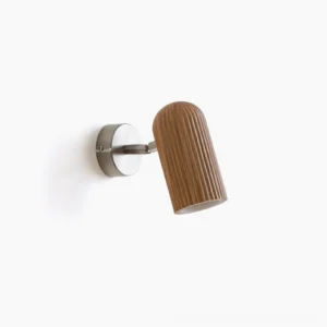 Donovan minimalist wall lamp with ribbed wood shade and brushed metal bracket, front view on white background