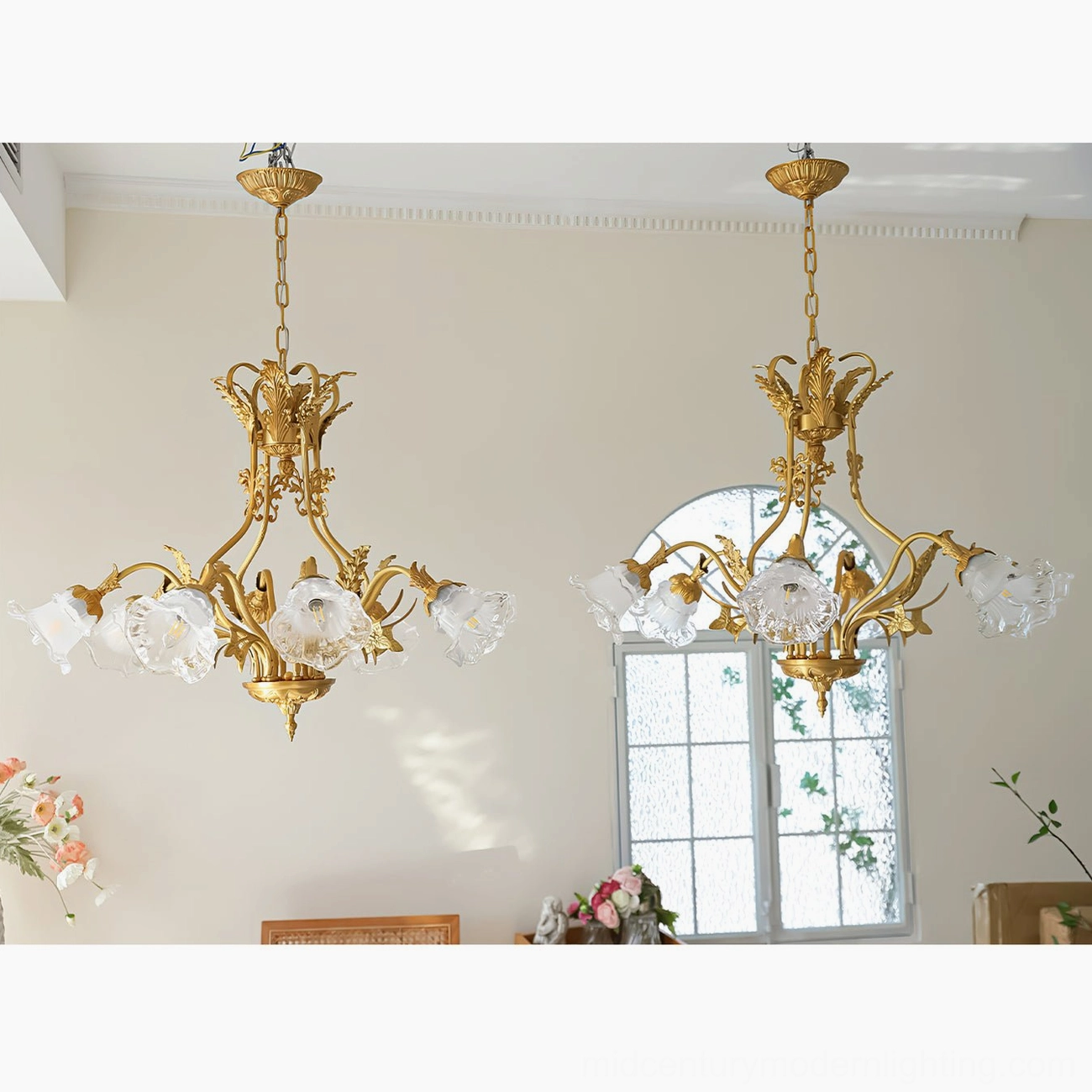 Dore brass flower chandelier with dimmed warm-toned lighting in sophisticated dining ambiance