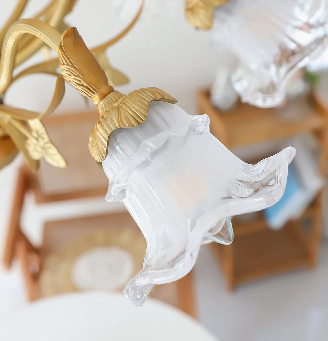 Six-light Dore brass flower chandelier in elegant interior with soft ambient lighting