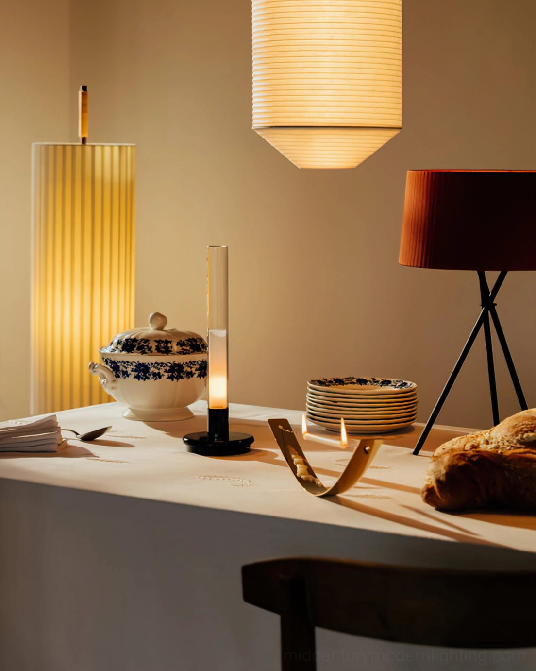 Dorica marble base floor lamp with paired pendant lighting in cozy residential dining setting