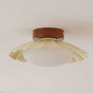Dorinda ceiling lamp side-overhead angle showing fluted scalloped shade design with frosted white glass diffuser, white wall background