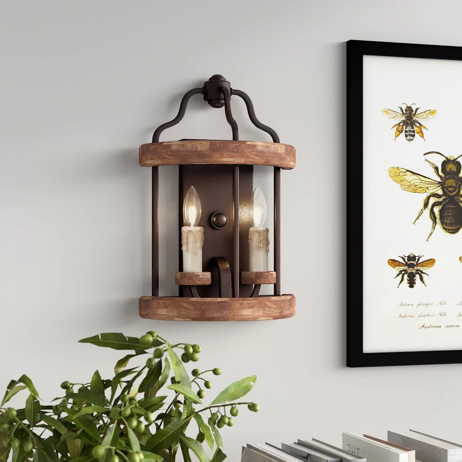 Double candle vintage sconce styled with botanical art print and potted greenery on accent wall