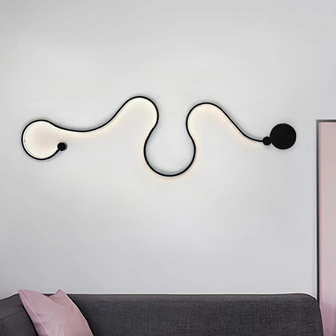 Double curved sculptural snake wall lamp mounted above gray sofa in modern minimalist bedroom