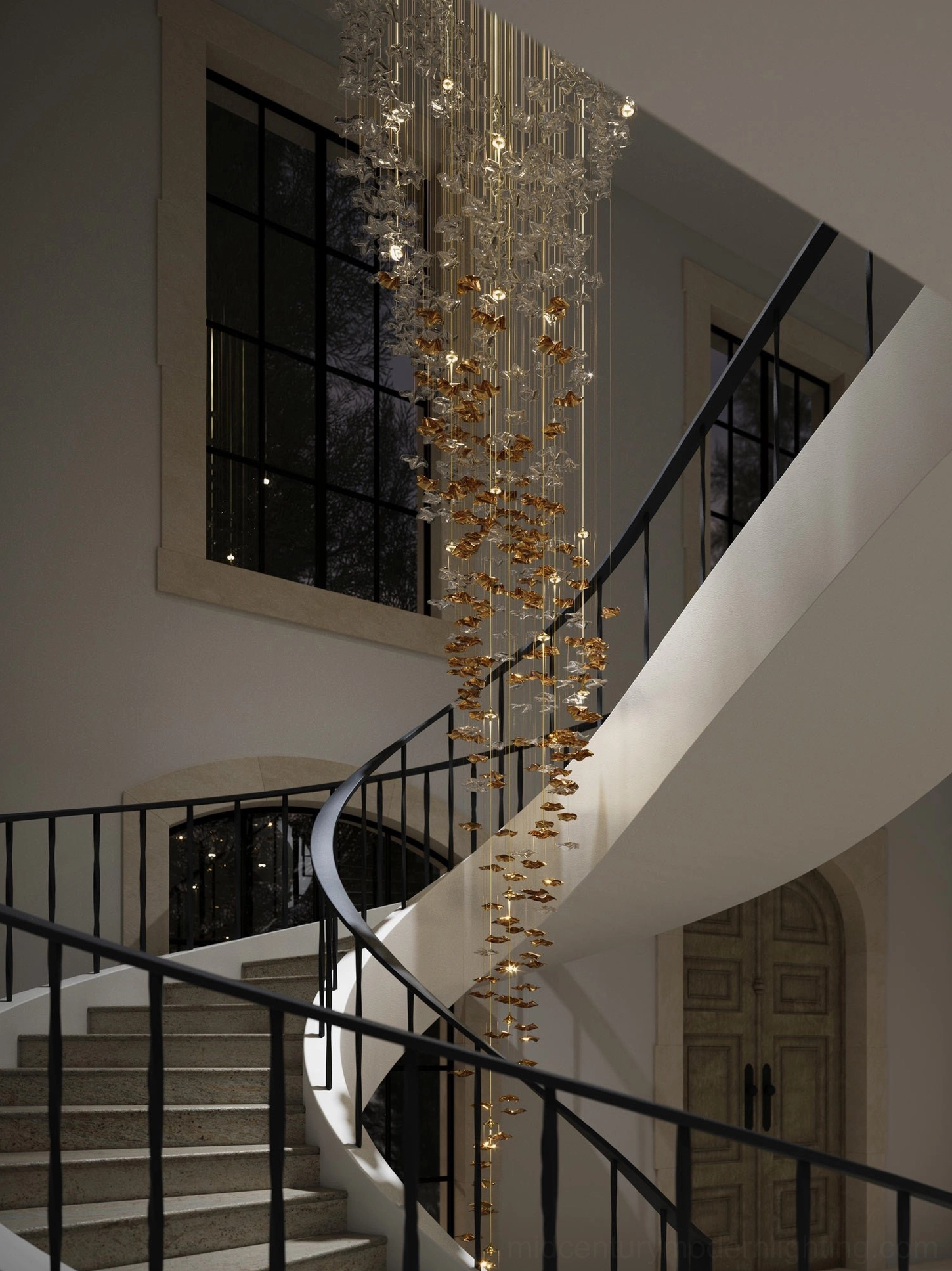 Double height staircase dramatic fluid glass chandelier sculptural lighting installation