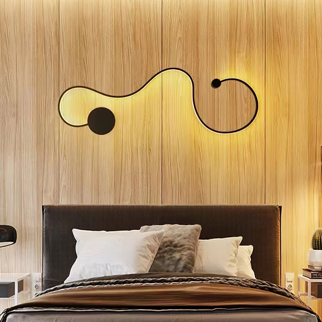 Split dual snake wall lamps installed on bedroom wood panel accent wall with warm ambient lighting
