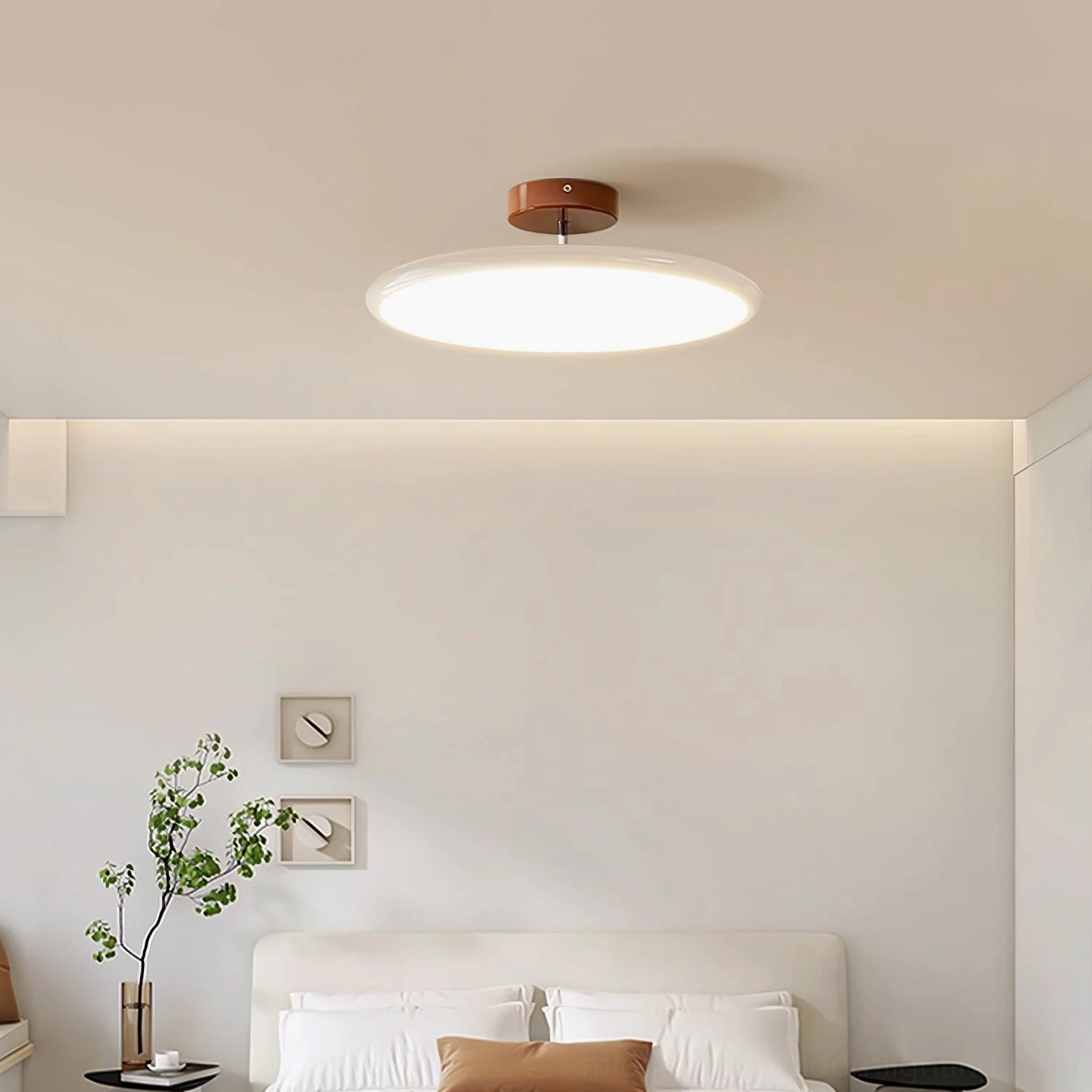 Drift flush mount lamp in minimalist bedroom photographed from below showcasing halo effect