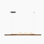 Drift Linear Pendant Light walnut wood modern LED chandelier front view on white background