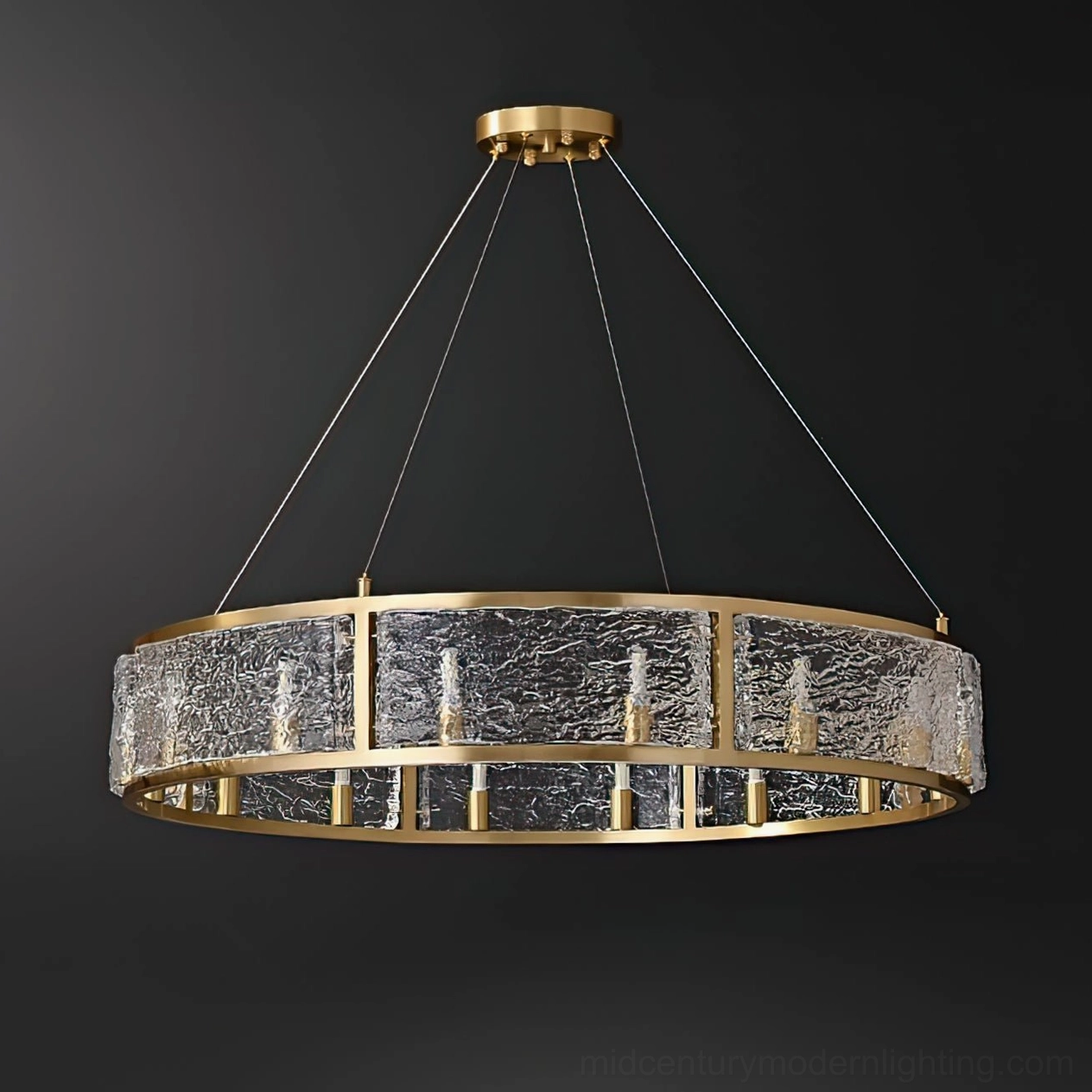 Illuminated drum chandelier with matte brass frame and candle bulbs studio photography