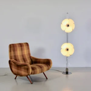 Dual Bloom Floor Lamp illuminated in warm contemporary living room with mid-century armchair and minimalist decor