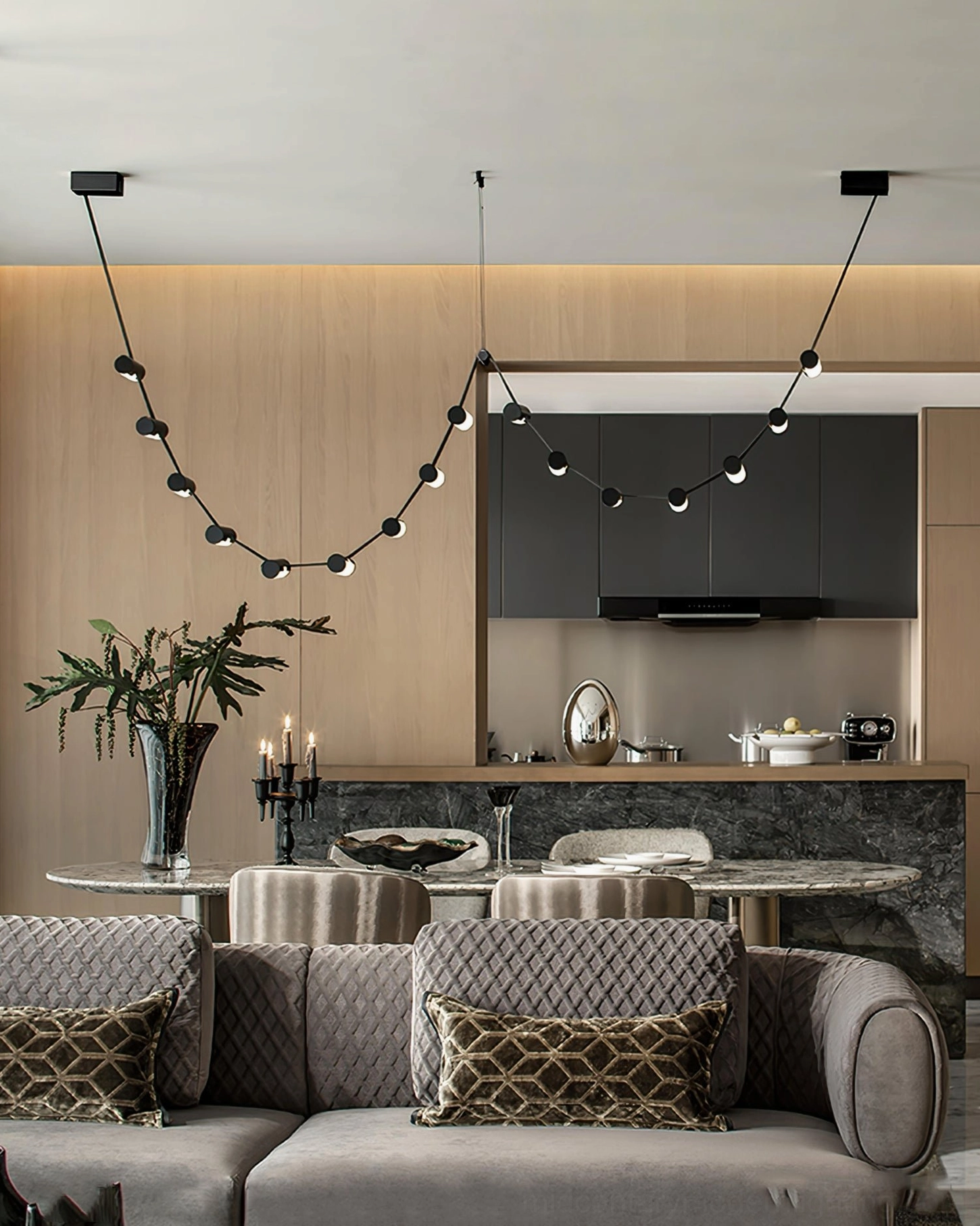 Dual curved pendant chandeliers in modern luxury open-plan living and dining space, warm neutral interior design
