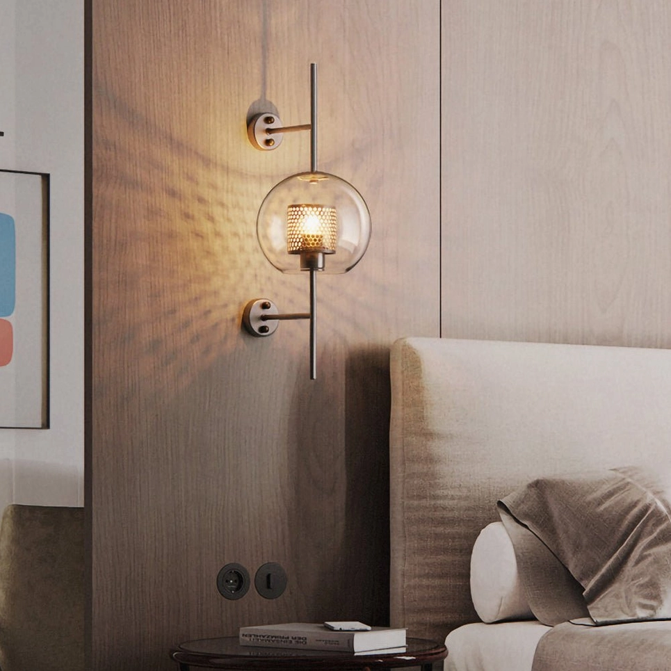 Matching pair of glass wall sconces in modern bathroom vanity setting, neutral tones