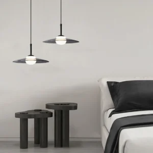 Pair of matching Julien pendant lights in modern minimalist bedroom, warm LED glow, mid-century design