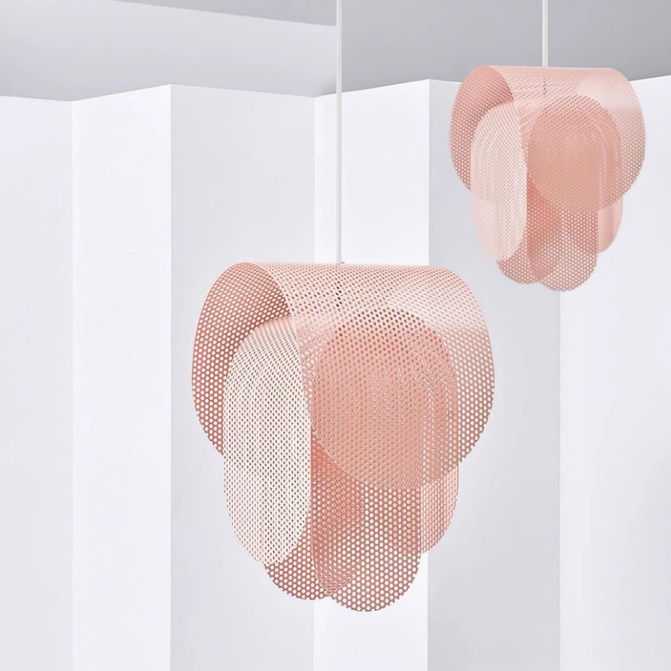 Two pink Posie pendant lamps hung at staggered heights in minimalist Nordic interior