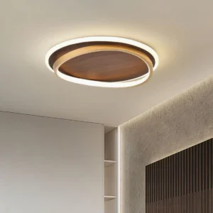 Dual-ring LED ceiling lamp installed in modern bedroom ceiling, upward view showing warm integrated LED lighting and architectural design