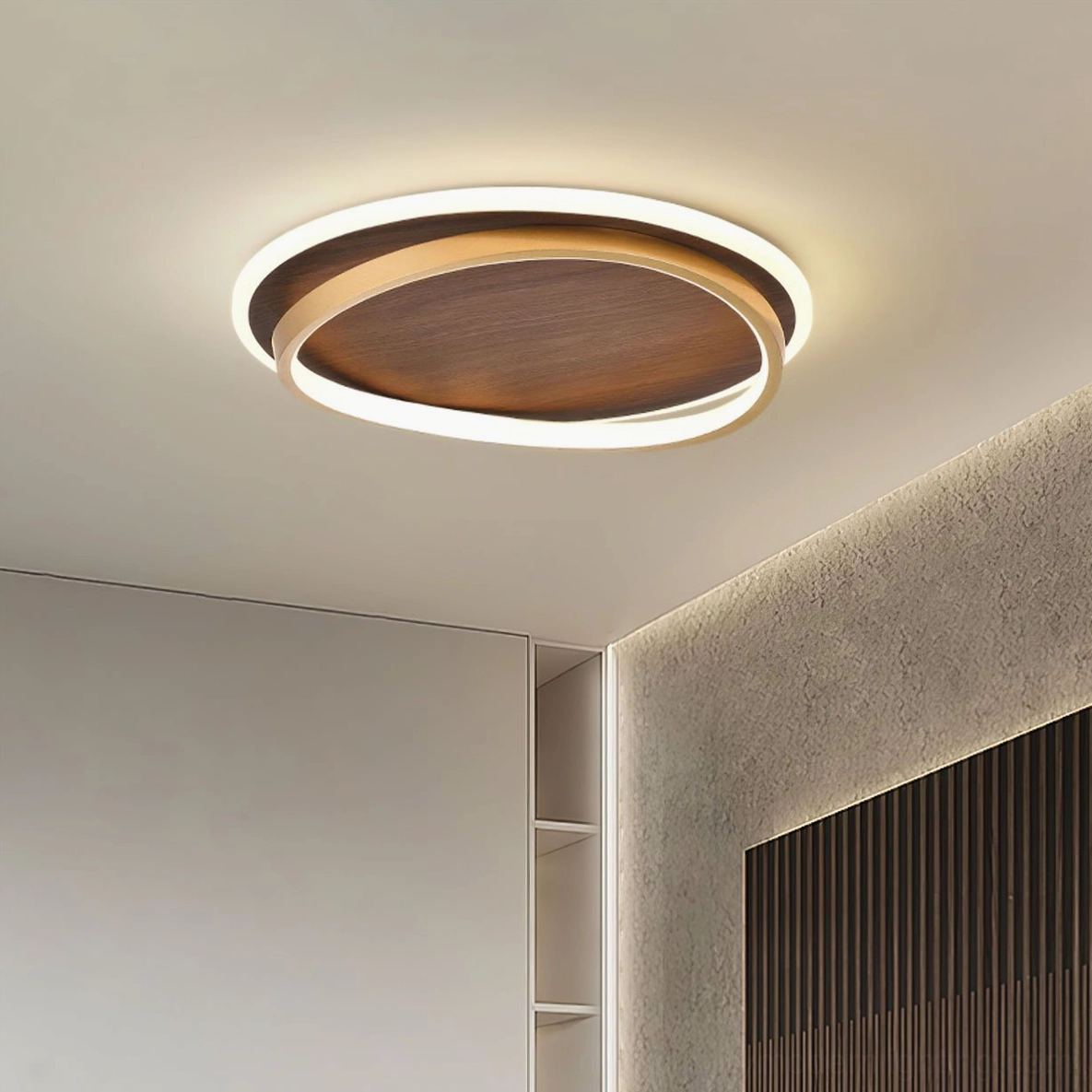 Dual-ring LED ceiling lamp installed in modern bedroom ceiling, upward view showing warm integrated LED lighting and architectural design