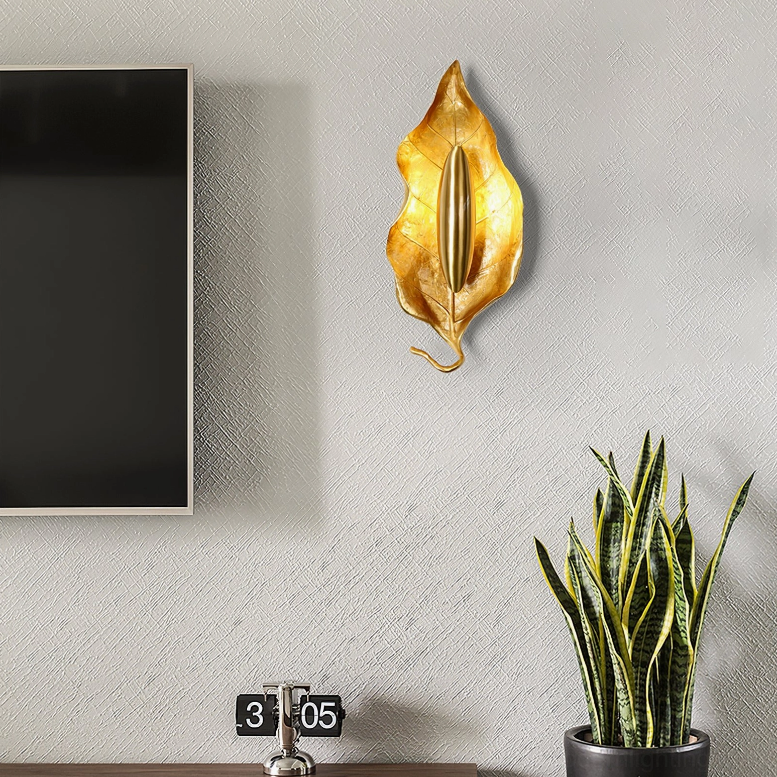 Dumaine leaf wall lamp close-up showing brass finish patina development and craftsmanship quality