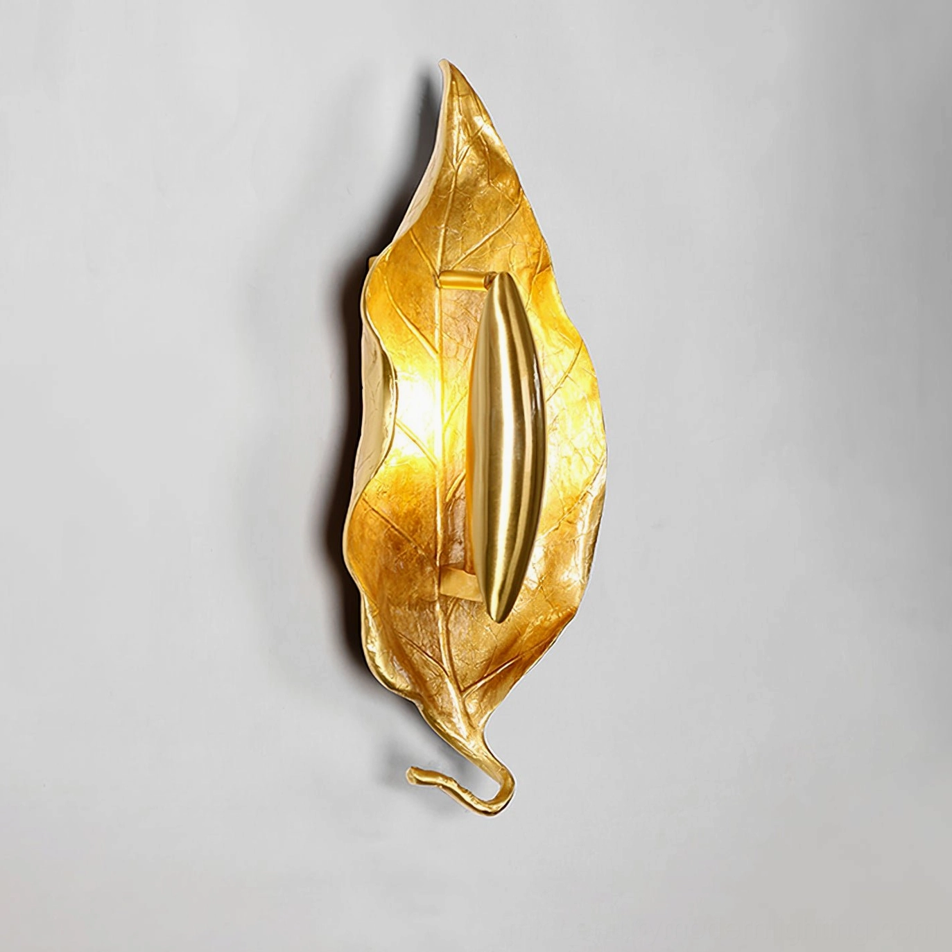 Dumaine modern leaf wall lamp showing how light interacts with textured aluminum leaf form