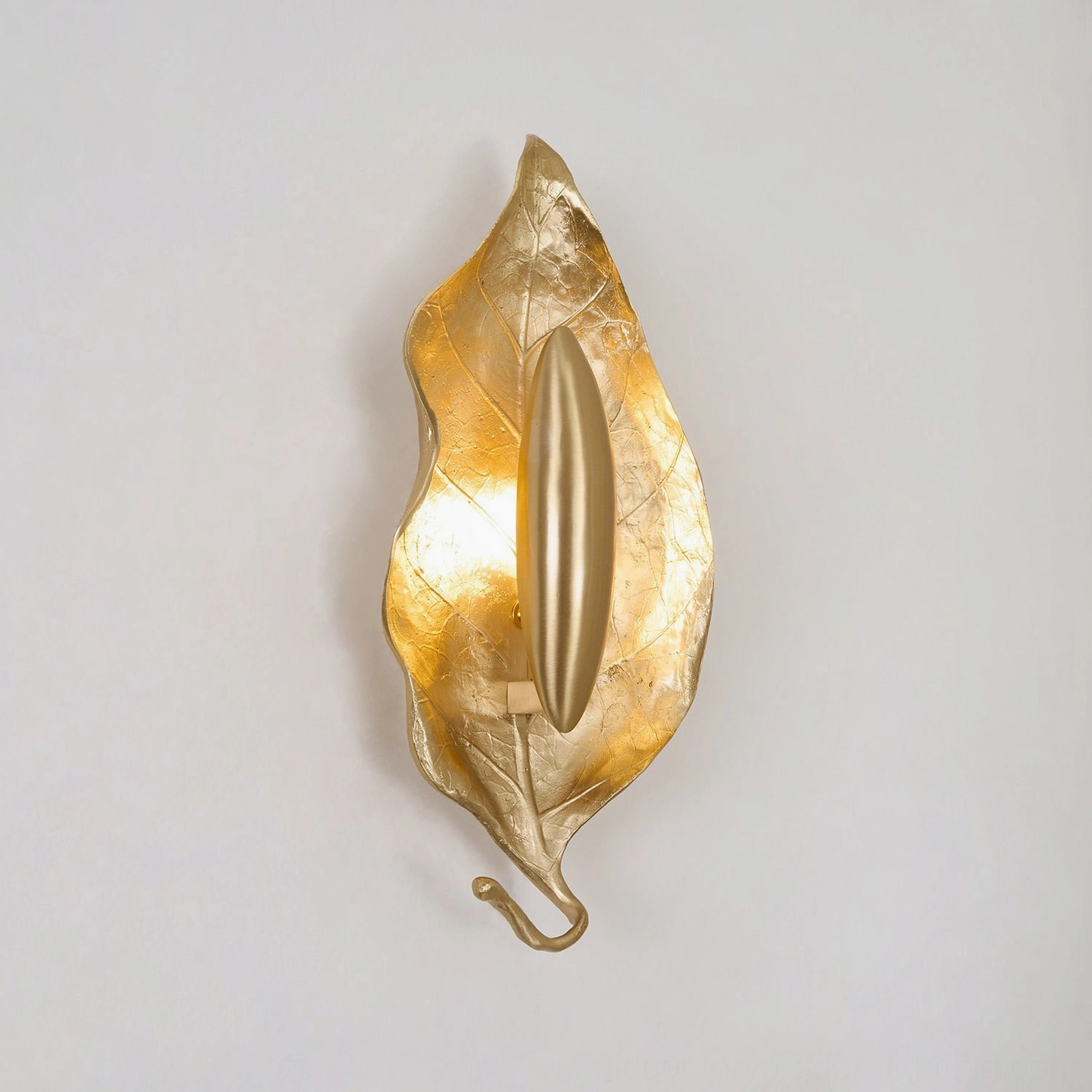 Dumaine leaf wall lamp detailed view highlighting organic metal leaf form and light diffusion properties