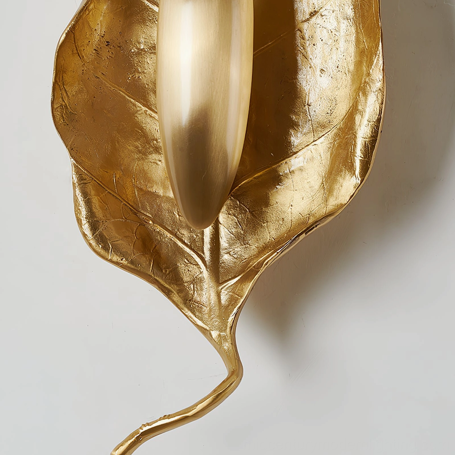 Dumaine brass leaf wall sconce Edison bulb compatibility shown with warm filament glow