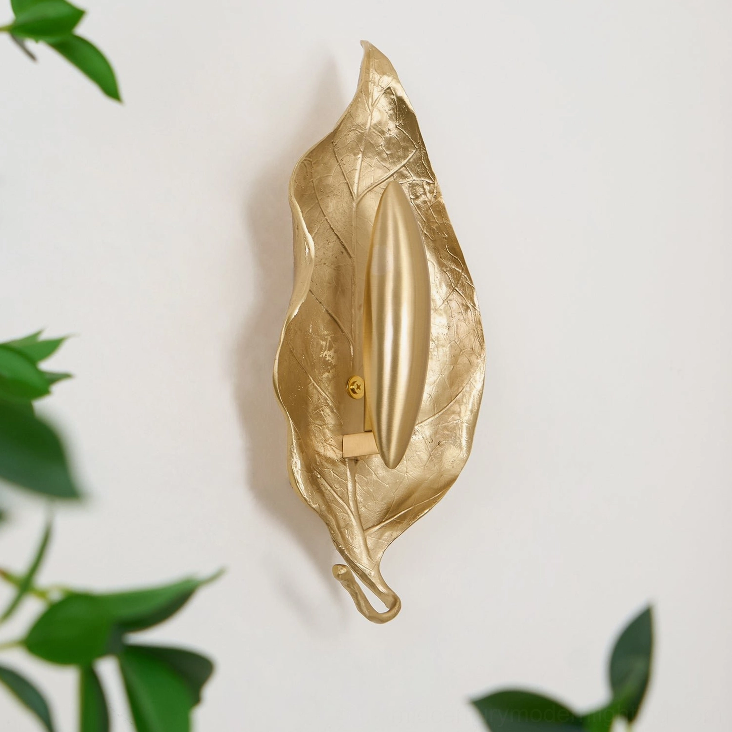 Rear view of Dumaine brass wall sconce showing installation brackets and back structural elements on white backdrop