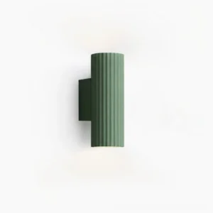 Dunbar ribbed wall sconce in green, front studio view showcasing matte aluminum texture and vertical geometric pattern