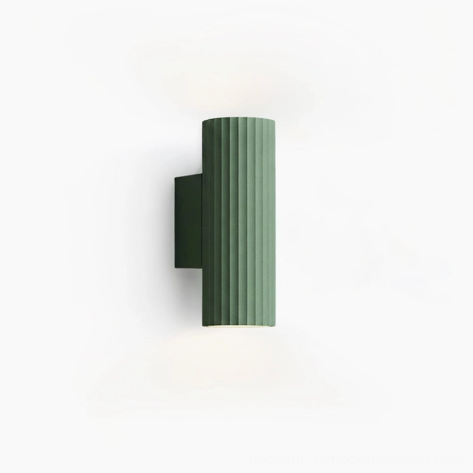 Dunbar ribbed wall sconce in green, front studio view showcasing matte aluminum texture and vertical geometric pattern