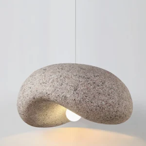 Dunia pendant lamp side profile showing curved pebble shape and granite-like finish