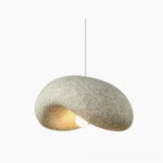 Dunia speckled pendant lamp front view with warm ambient lighting and stone texture