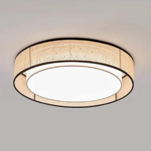 Close-up front view of Duolla flush mount ceiling light showing beige woven jute fabric dome with black metal trim edge