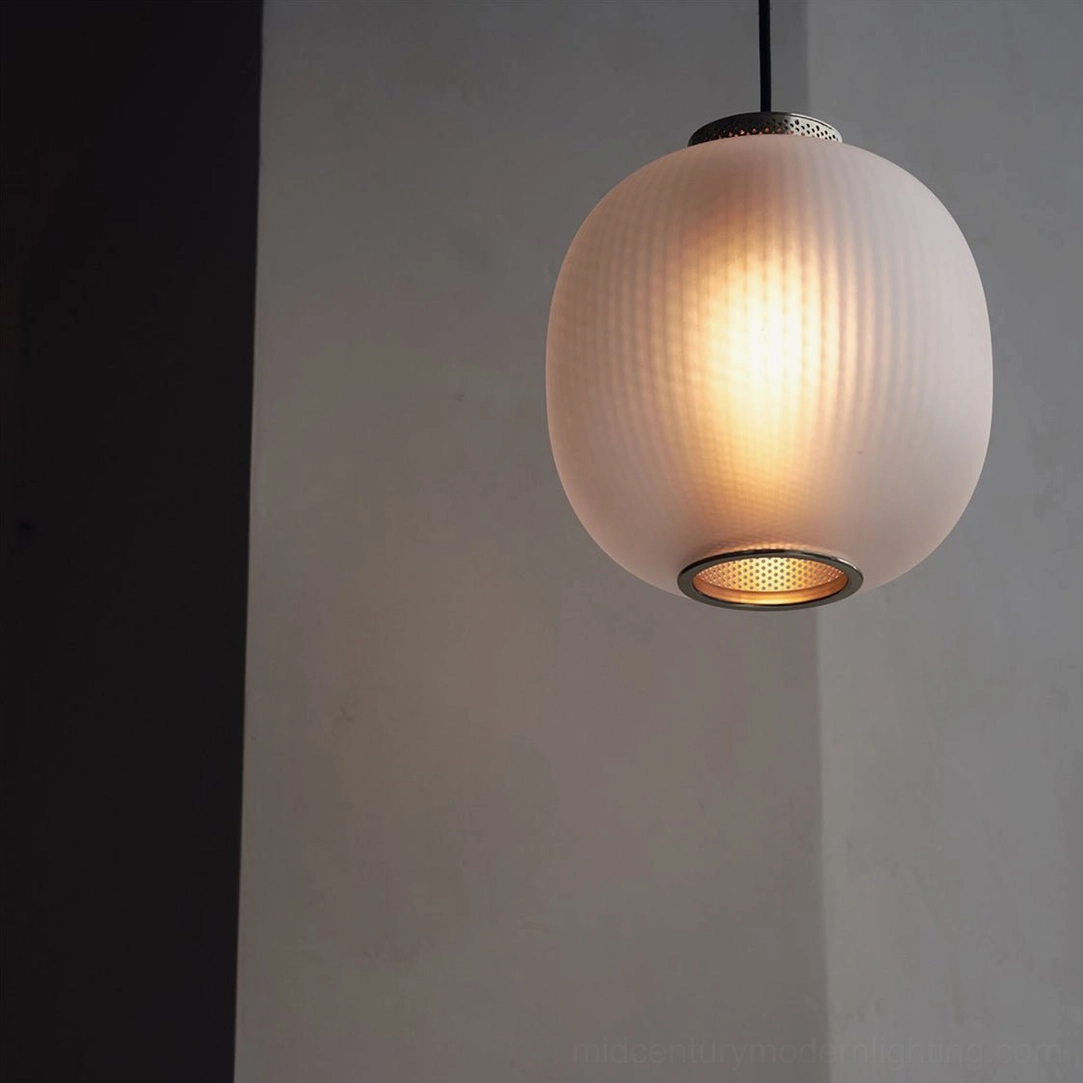Dynamic pendant light detail showing frosted glass and perforated mesh construction