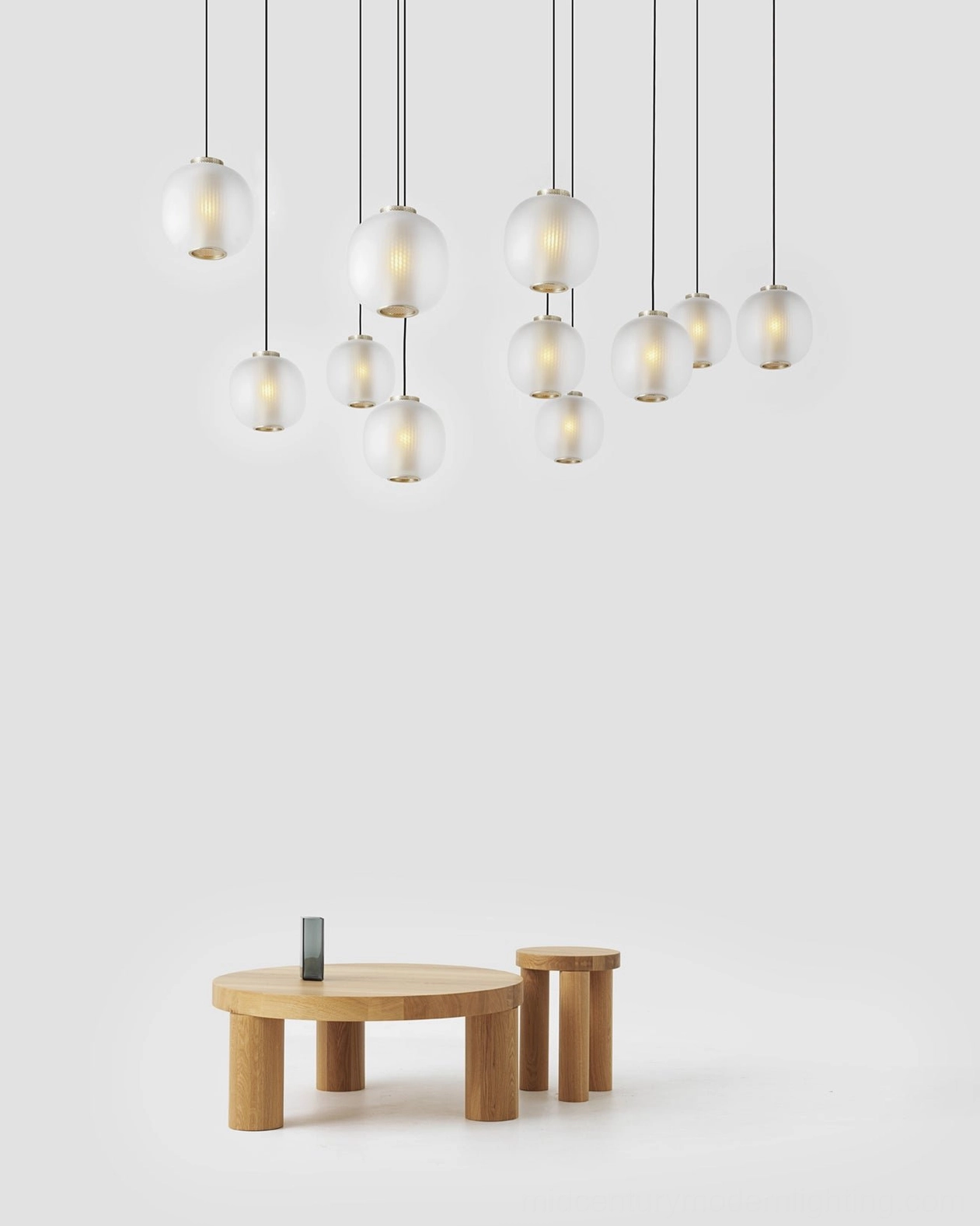 Pendant light casting geometric shadow patterns on ceiling and walls