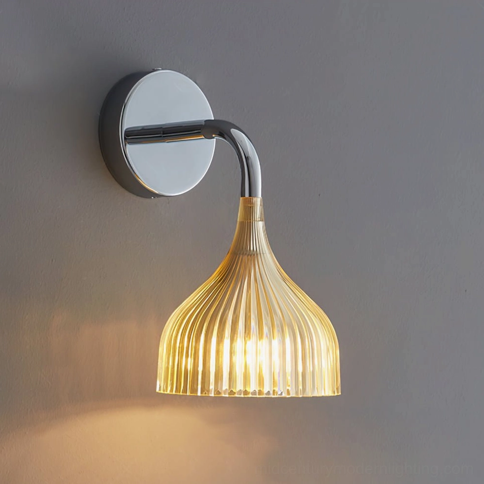 Amber ribbed wall lamp with chrome bracket on gray wall, warm lighting effect