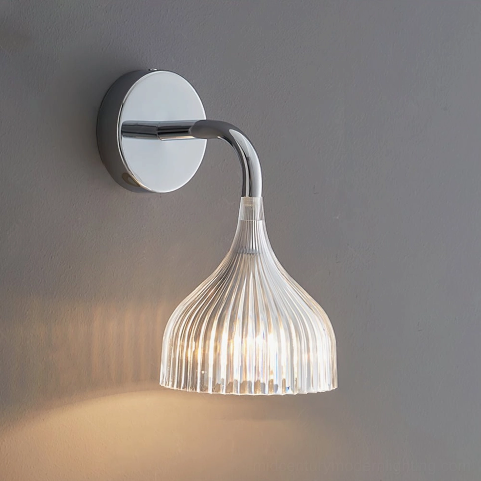 Clear ribbed glass wall sconce with chrome fixture on dark gray wall, soft warm ambiance