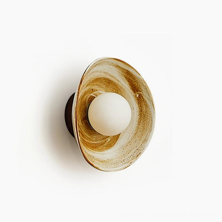 Eala ceramic wall lamp product shot highlighting sculptural bowl design and frosted glass light diffusion