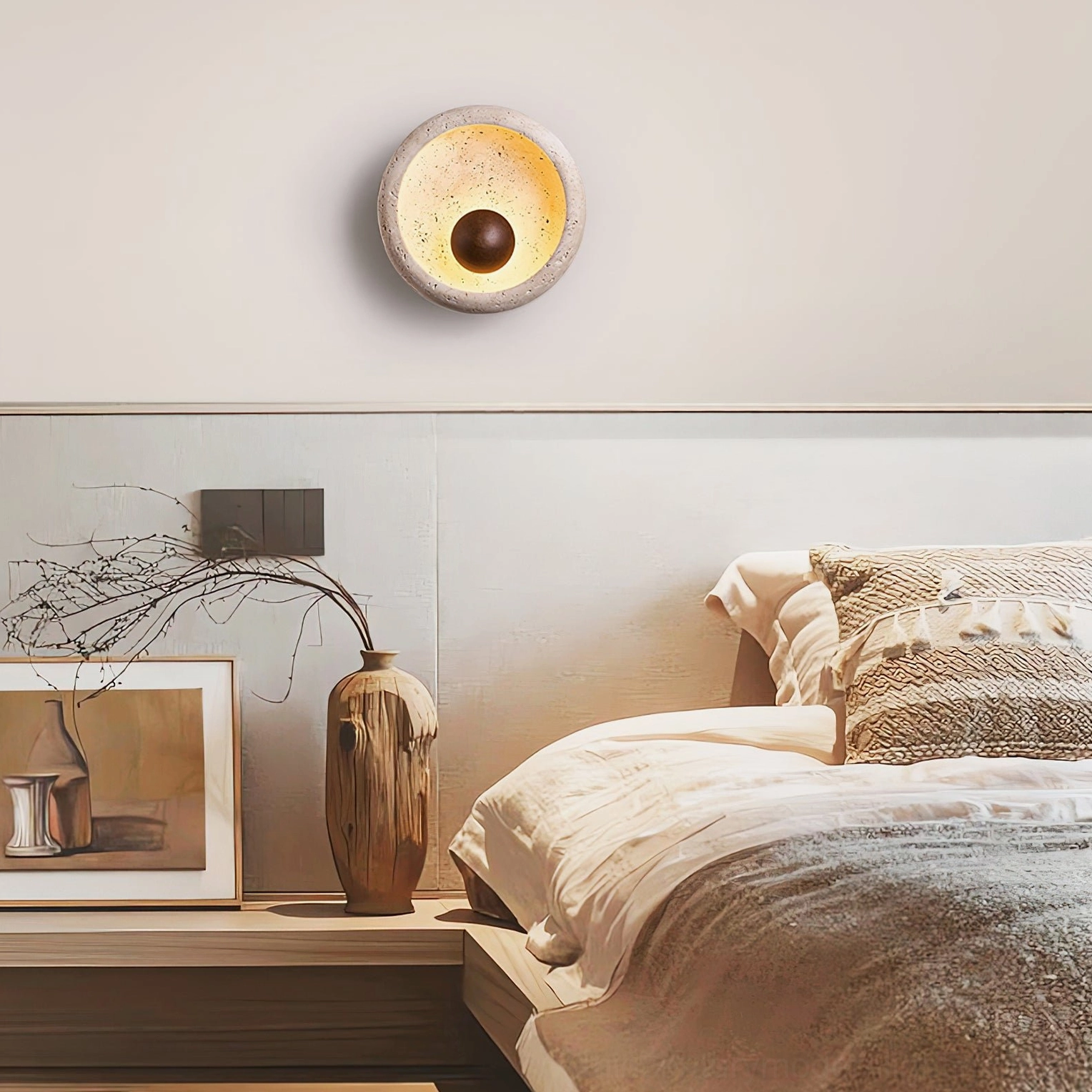 Eala travertine wall sconce mounted in modern bedroom interior design setting
