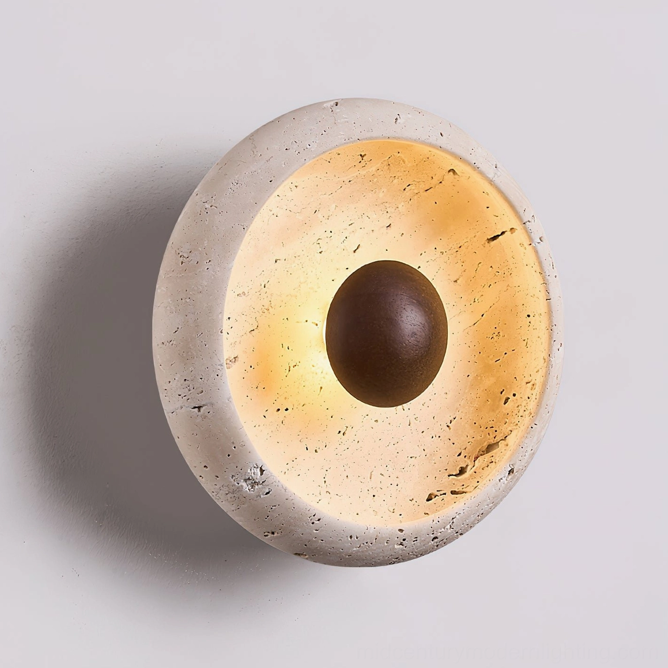 Left side close-up view of Eala travertine wall lamp sculptural design