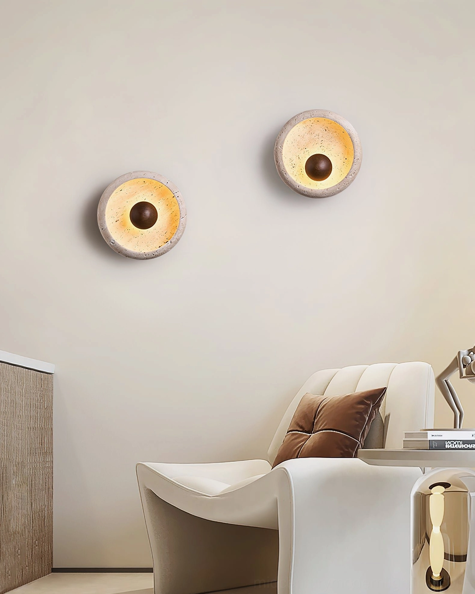 Eala travertine wall sconce creating ambient glow in cozy bedroom ambiance