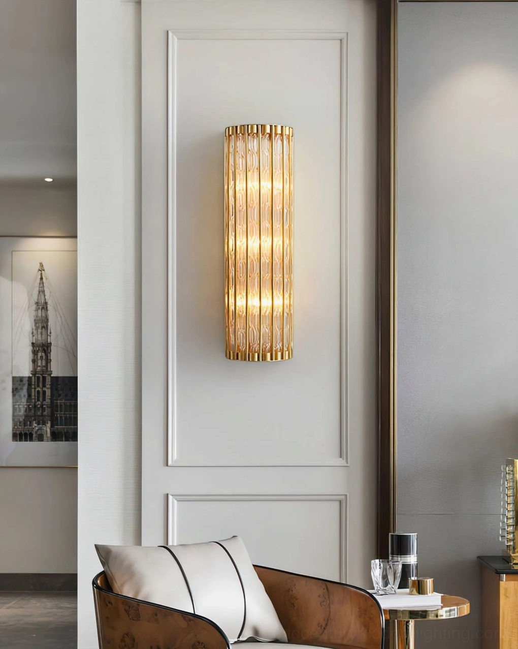 Modern lounge space with linear glass and brass wall light, neutral interior styling, distant eye-level view