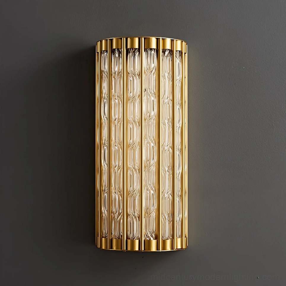Modern linear wall lamp mounted on dark gray accent wall, close-up detail of ribbed glass texture and brass hardware