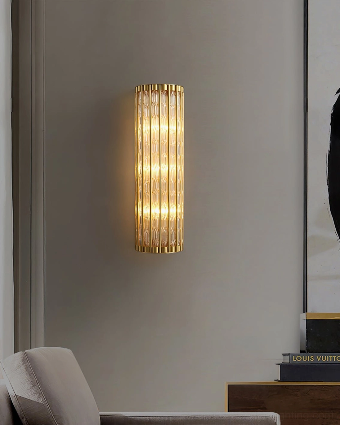 Eaton linear brass wall sconce architectural detail shot, showcasing ribbed glass cylinder and polished frame