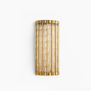 Eaton Linear brass wall sconce with ribbed glass cylinder, front studio view showing polished brass frame and fluted glass diffuser