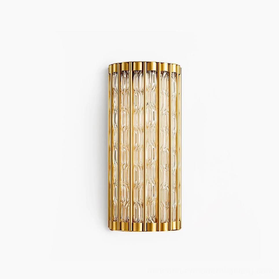 Eaton Linear brass wall sconce with ribbed glass cylinder, front studio view showing polished brass frame and fluted glass diffuser