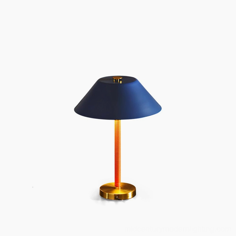 Eave navy blue and brass gold mid-century modern table lamp front studio shot, geometric metal design with ribbed orange stem