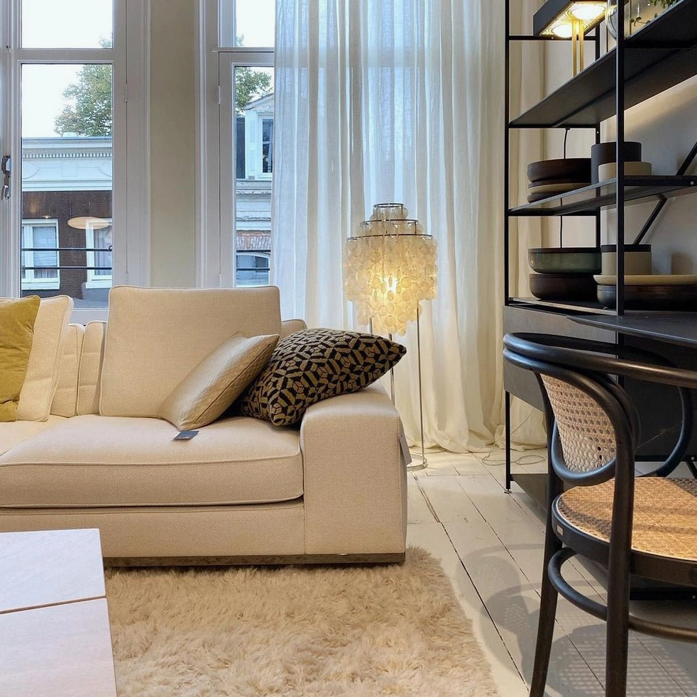 Contemporary shell floor lamp in eclectic home decor with vintage and modern mixing