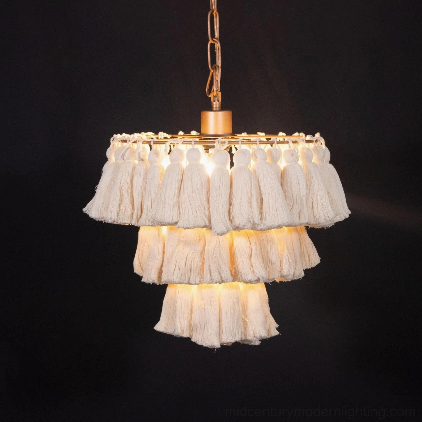 Eclectic tassel pendant light installation demonstrating sizing and proportion in residential setting