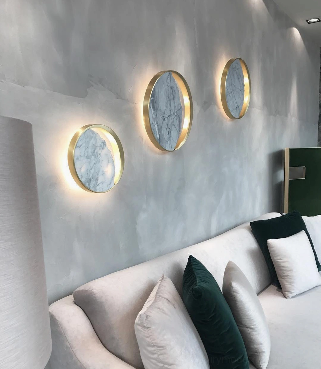 Eclipse marble wall lamp layered lighting design with ambient ceiling fixtures coordination