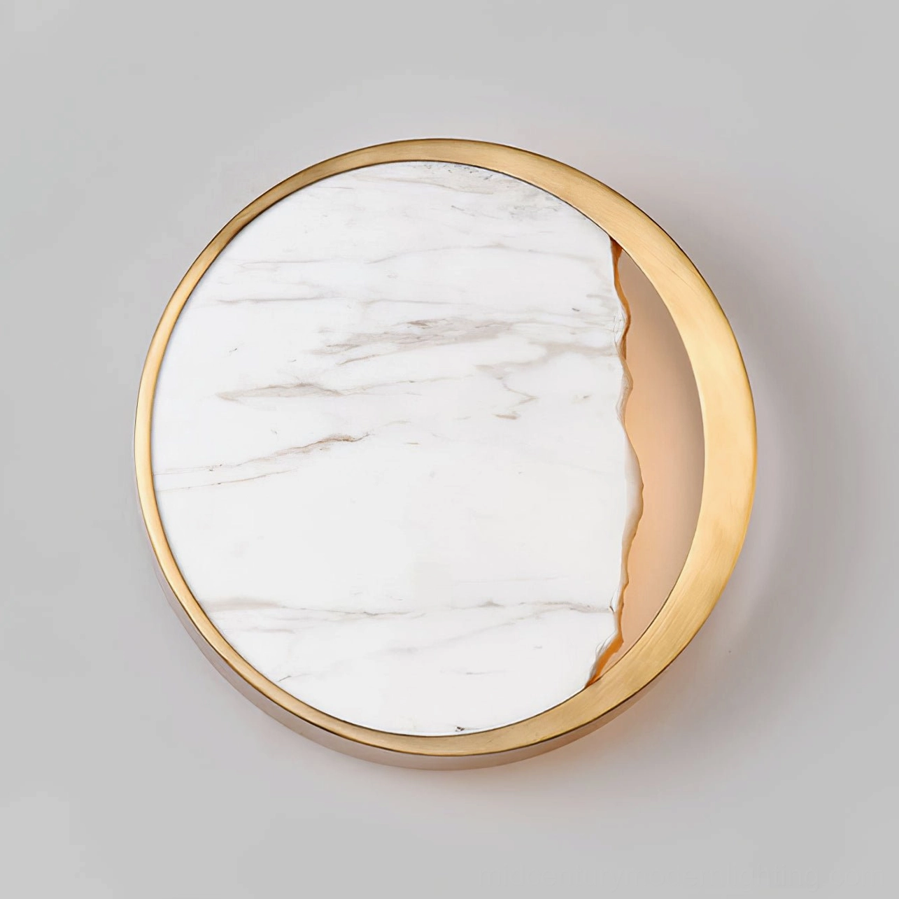 Eclipse marble wall lamp close-up detail showing split marble panel design and gold circular frame