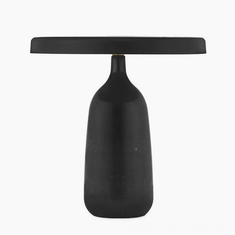 Black Eddy table lamp disc shade round base sculptural form