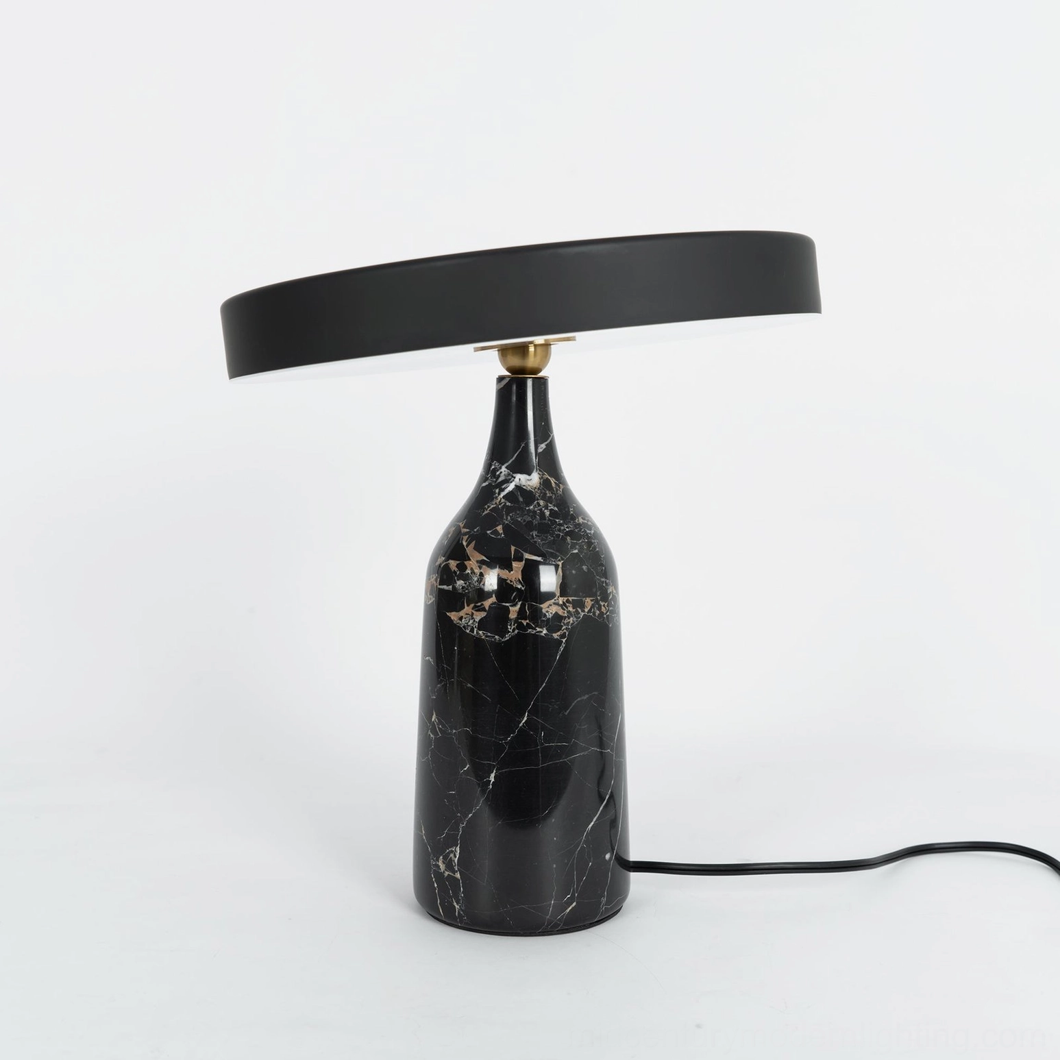 Eddy rotating table lamp in contemporary home office workspace setup