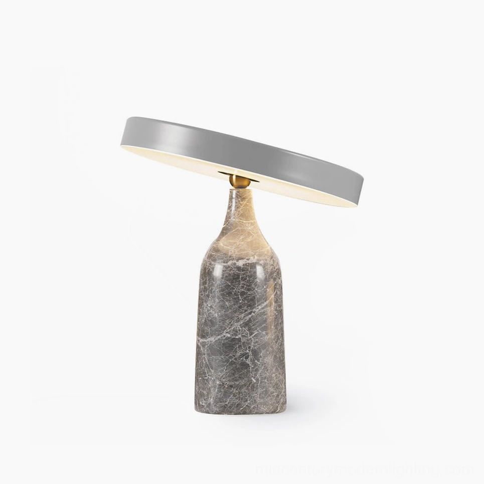 Eddy modern rotating disc table lamp with grey metal shade and grey marble base, front view studio lighting